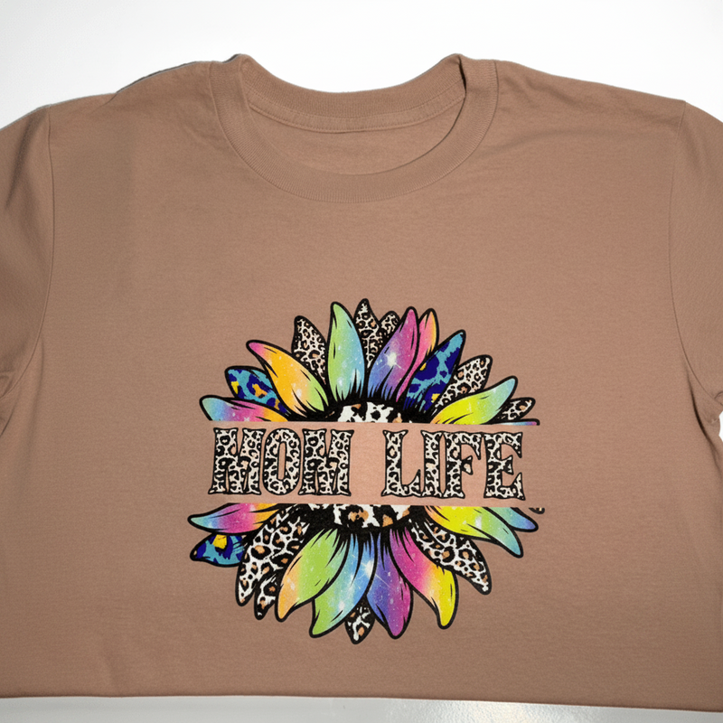 Brown t-shirt with colorful 'FLUFF' design on a white background