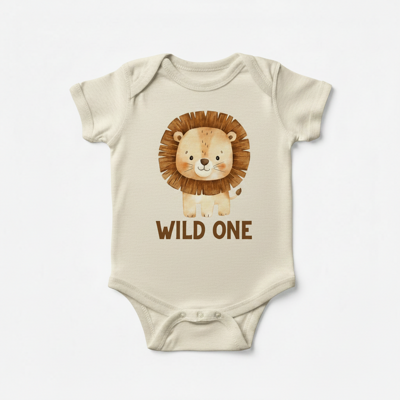 Beige baby onesie with a lion graphic and 'Wild One' text on a white background