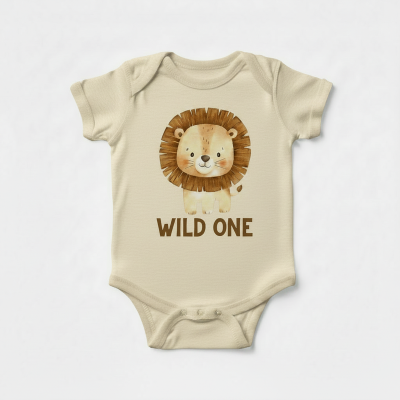 Beige baby onesie with a lion graphic and 'Wild One' text on a white background